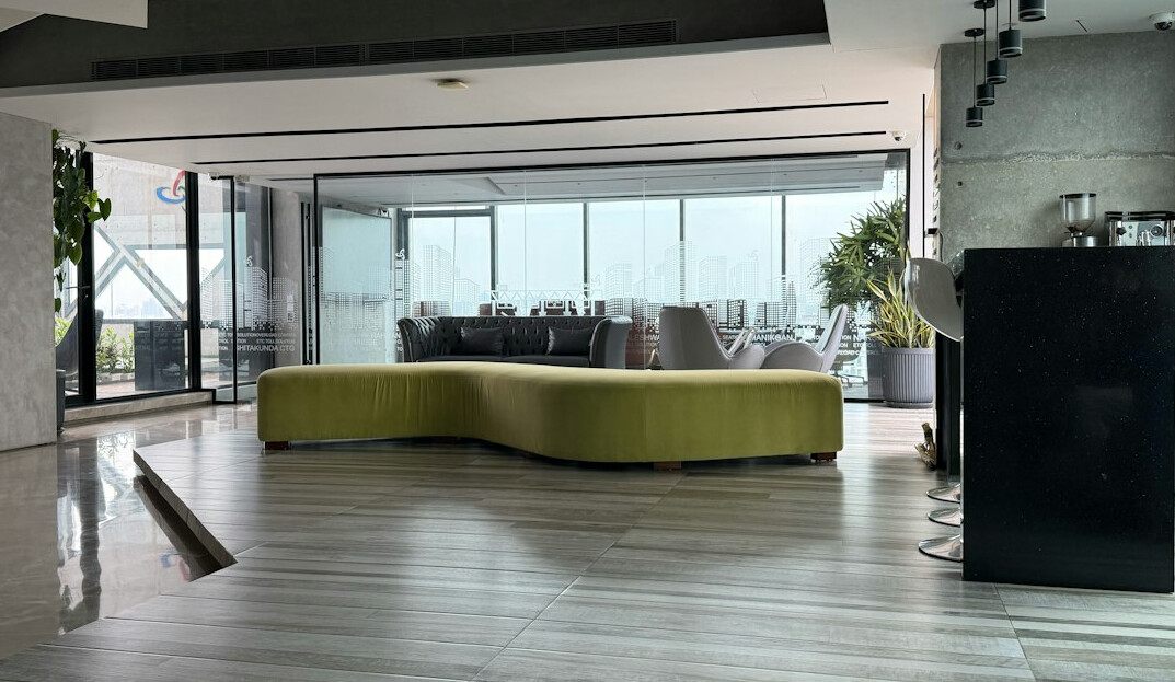 Bright modern office interior with desks and large windows
